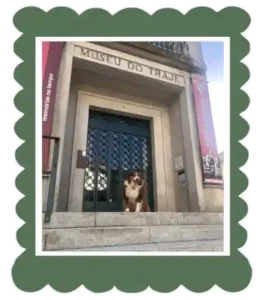 Bucky dog australian shepperd in front of the clothing museum in Viana do Castelo Portugal