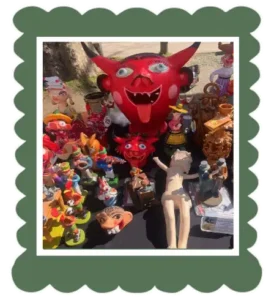 Paper mache devil's face red antique market Ponte de LIma Portugal